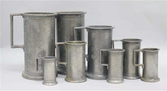 Eight French Provincial graduated pewter measures